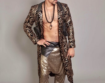 May include: A man wearing a black and gold patterned jacket with a black bandana, a gold necklace, and gold sequined pants. He is also wearing black boots.
