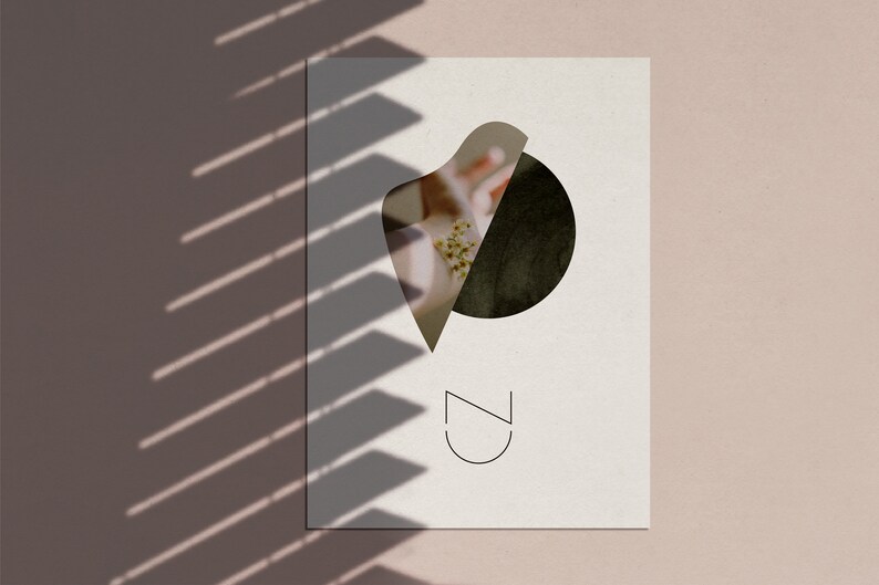 May include: A white card with a black circle and a white abstract shape cut out of it. The cut out shape reveals a floral image. The text "CZ" is printed in black at the bottom of the card.