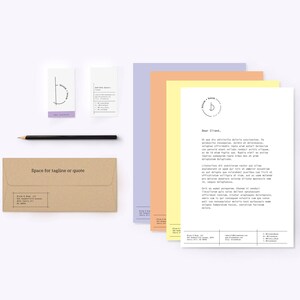 May include: A brown envelope with the text "Space for tagline or quote" printed on the front. There are also four cards with a simple logo design of a circle with a line through it. The logo is in black and white. The cards are on a white background.