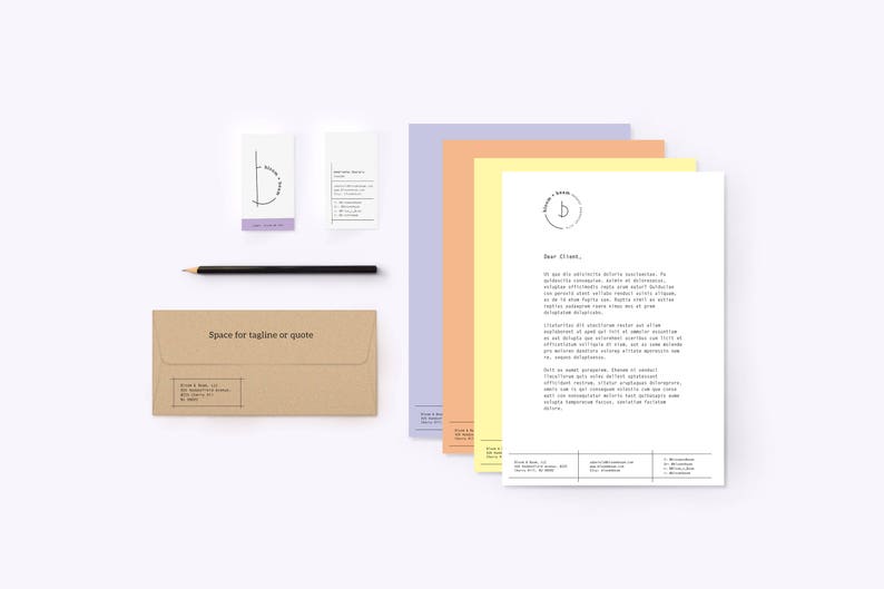 May include: A brown envelope with the text "Space for tagline or quote" printed on the front. There are also four cards with a simple logo design of a circle with a line through it. The logo is in black and white. The cards are on a white background.