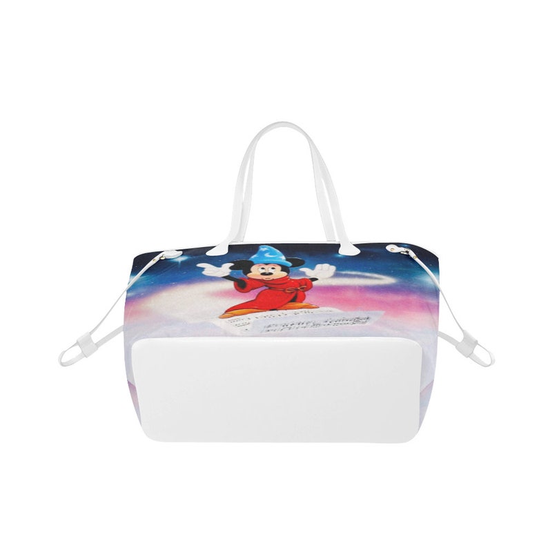 May include: White tote bag featuring a colourful image of Mickey Mouse as a sorcerer. The image depicts Mickey Mouse in a red robe and blue hat, against a starry backdrop.