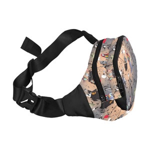 May include: A black fanny pack with a zipper closure and an adjustable strap. The fanny pack has a beige background with a colorful print of characters from the movie "The Nightmare Before Christmas".