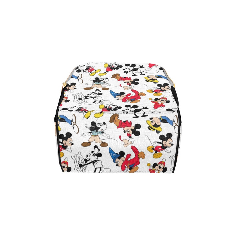 May include: A white backpack with a black zipper and a pattern of Mickey Mouse characters in various poses and colors.