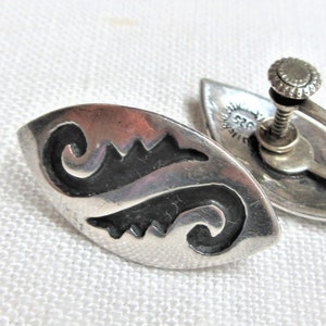 1950s Mexican sterling silver screw back earrings with a Southwestern design, marked 925 Taxco, Mex and a makers mark.