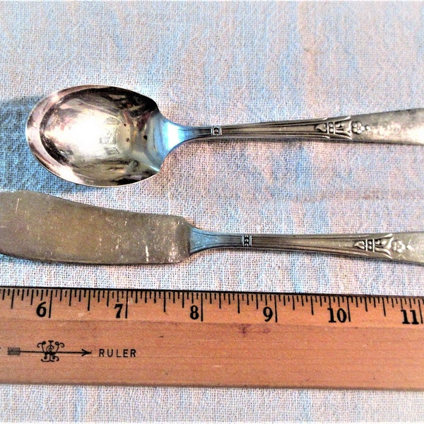 Simeon L & George H Rogers Co Encore pattern silver plate butter knife and fruit spoon from 1934. A little plate loss  and bent tip