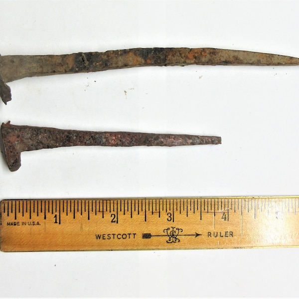 Salvaged rusty hand forged spikes, square nails. Antique nails are 3.75" long and 5.5" long