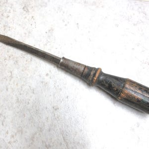 Rusty old flathead screwdriver with a 3/8&quot; drive and a square shank that goes into a wooden handle.