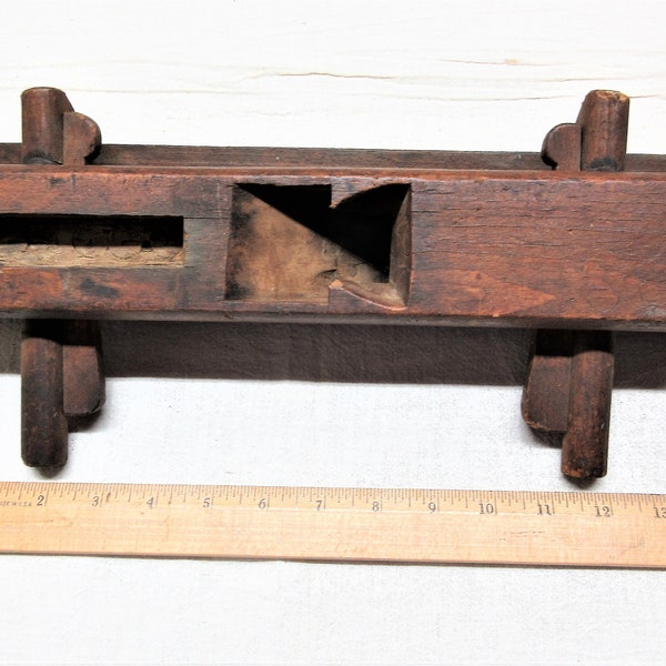 Antique wood molding plane. Missing a blade and the handle. It is about 14" long. Has pegged adjustments