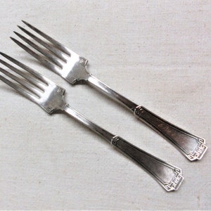Antique silver plate dinner forks, 7.5" long. 1881 Rogers Grecian pattern from 1915. Good used condition with fine scratches.
