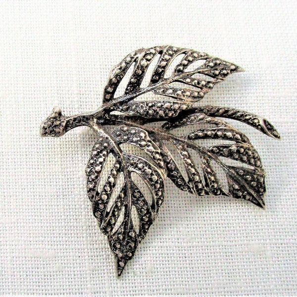 Vintage Danecraft sterling silver floral leaf brooch. Vintage silver brooch measures 1.75". In good used condition.