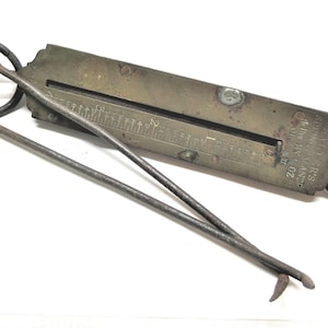 Salters Spring Balance Hanging Scale, hooks. Class II with 4 lb capacity in 1/2 oz increments. Brass face with rusting metal back. They work