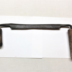 Antique draw knife, straight spoke shave. 15&quot; long, blade is 10&quot; long.  Well used and re-shaped over the years. Rusty with worn out handles