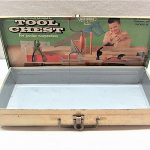 Vintage tin box. Empty toy tool box made by American Toy and Furniture Co, Chicago. 12&quot; long. Inside is clean. Outside has scuffs paint loss