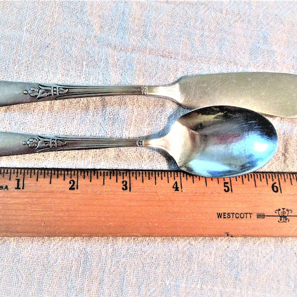 1930s silver plate butter knife and fruit spoon by Simeon L & George H Rogers Co Encore pattern from 1934. Some plate loss