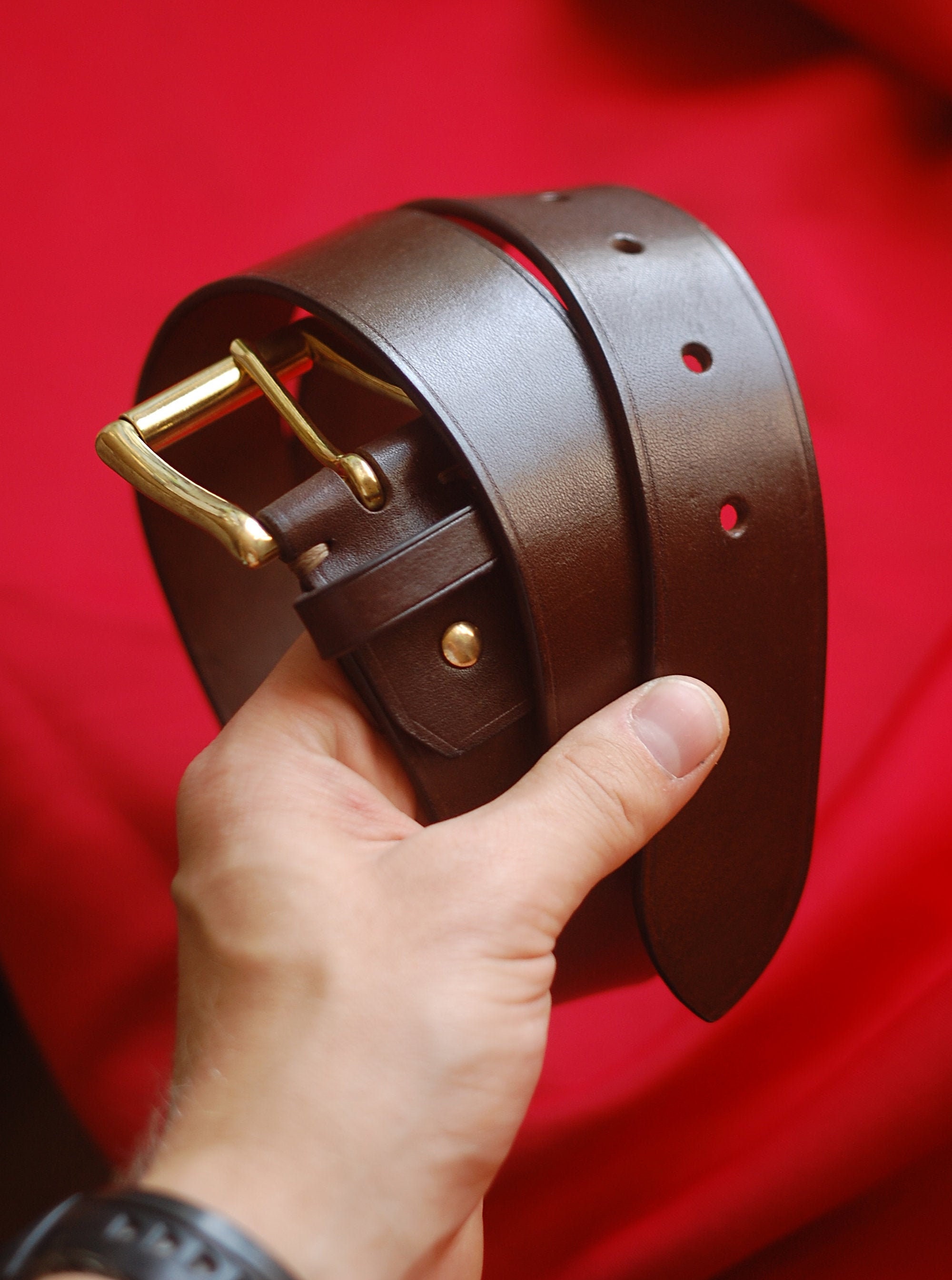 Dark brown leather belt with brass buckle app. 135cm, 22,99 €