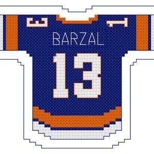 May include: A blue and orange hockey jersey featuring the name "BARZAL" and the number "13" in white. The jersey has orange and white details and a white border.