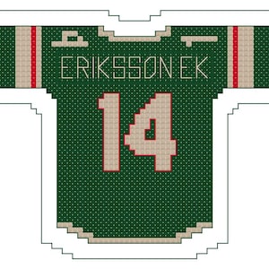 May include: A green and tan hockey jersey with the name "ERIKSSON EK" and the number "14" in tan and red. The jersey has tan and red stripes on the shoulders.
