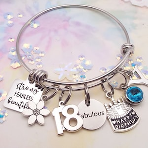 This is a 18th birthday charm bracelet. It is made from stainless steel and contains the charms Strong Fearless and Beautiful, a flower, the #18, Fabulous, a birthday cake and the initial and birthstone of your choice. A great gift for a teen girl.