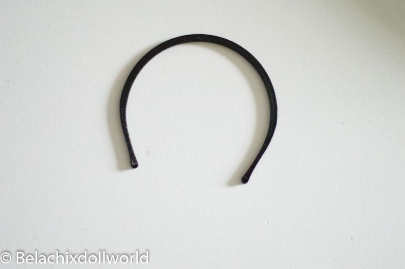 May include: A black headband for hair.