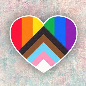 May include: A heart-shaped sticker with a rainbow flag design and a brown, blue, and pink chevron pattern in the center.