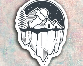 May include: Black and white line art illustration of a mountain range with a full moon and stars in the night sky. The mountain range is on a cliff that is breaking apart and falling away.