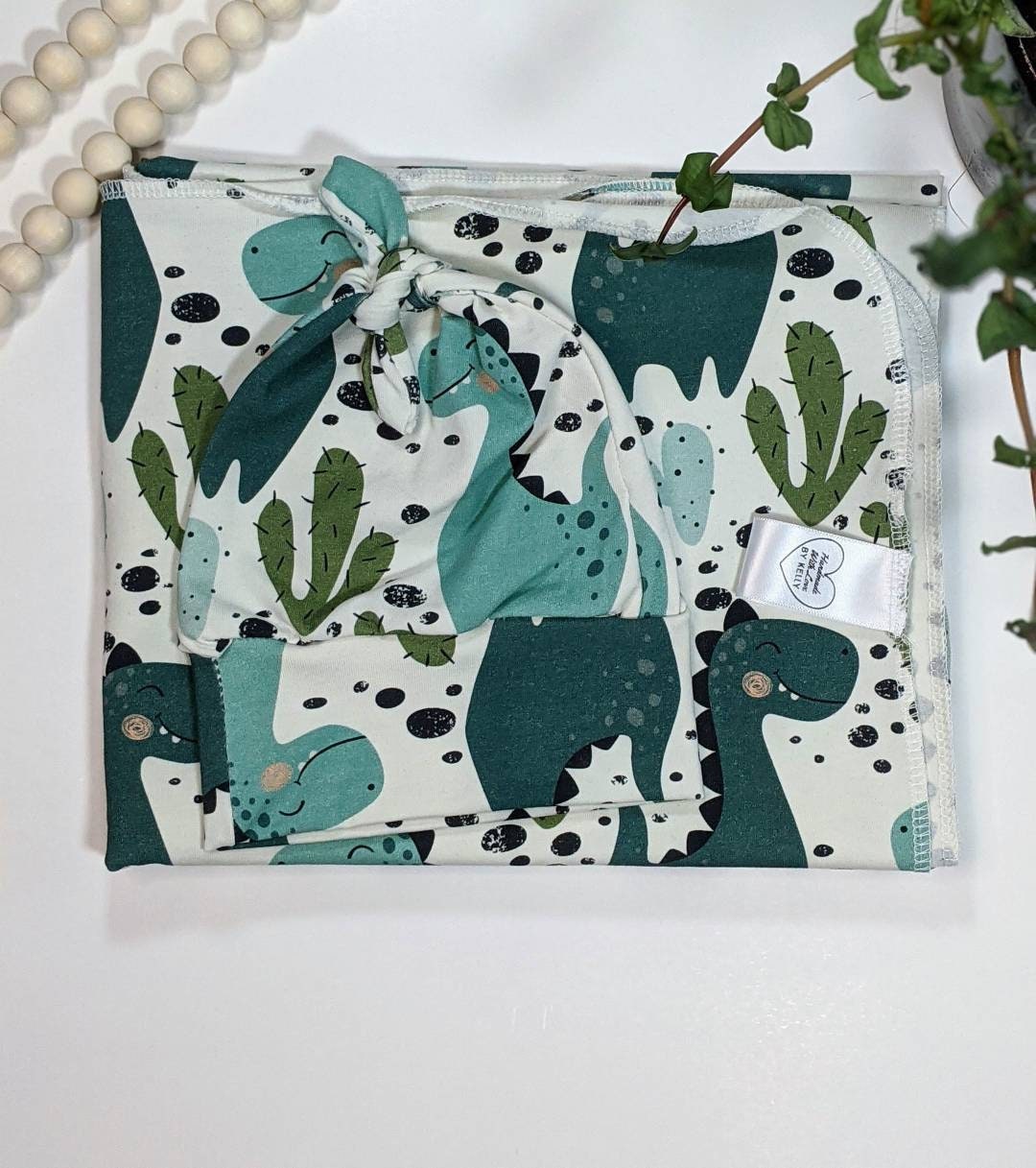 Dinosaur baby swaddle blanket set with matching hat. This Etsy