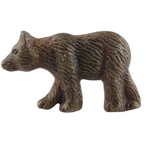May include: A bronze-colored bear figurine, sculpted in a walking pose. The bear has detailed fur texture and is set against a white background. This decorative item could be used as a cabinet knob or drawer pull.