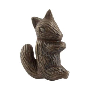 May include: A bronze-colored squirrel figurine in a standing pose. The squirrel has a textured surface, with details like its tail, ears, and facial features clearly visible. The figurine is a decorative item, likely for home decor.