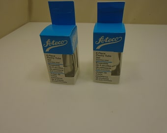May include: Two boxes of Ateco 6-piece pastry tube sets, made of stainless steel. The boxes are blue and white with the Ateco logo and product information in English, French, and Spanish.