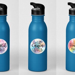 May include: Three blue water bottles with colorful watercolor stickers. The stickers have inspirational messages and bible verses. The first sticker says "I am Accepted Romans 5:17". The second sticker says "I am Chosen 1 Peter 2:9". The third sticker says "I am Fearless Psalm 27:1".