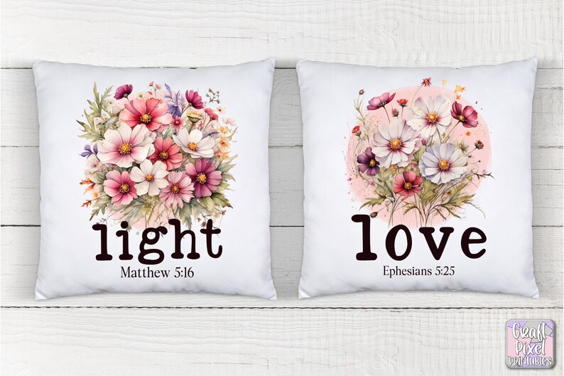 May include: Two white pillowcases with floral designs and inspirational quotes. The left pillowcase features a bouquet of pink and white flowers with the text "light" and "Matthew 5:16". The right pillowcase features a bouquet of pink and white flowers in a circle with the text "love" and "Ephesians 5:25".