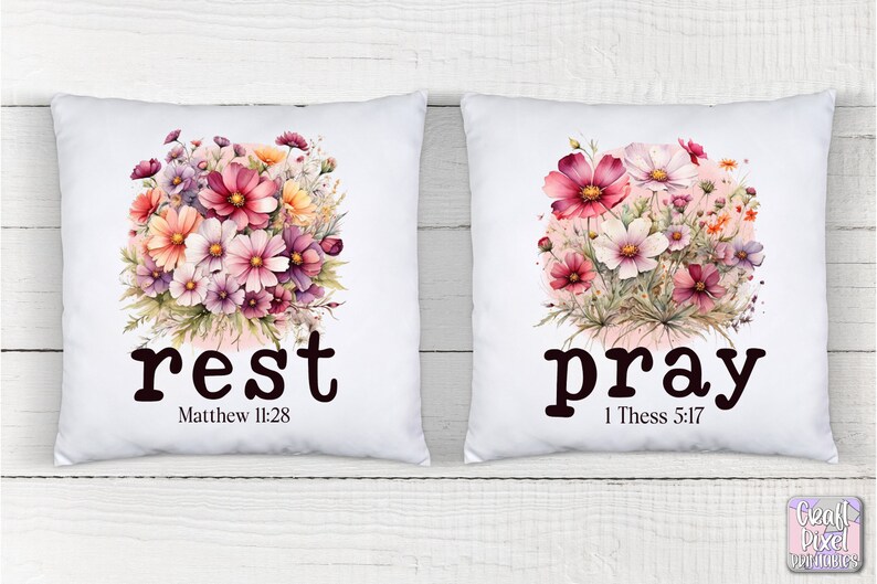 May include: Two white pillow covers with floral designs and the words "rest" and "pray" with bible verses. The floral design is pink, white, and yellow.
