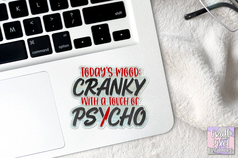 May include: A white sticker with a black and red design that says "Today's Mood: Cranky with a touch of Psycho".