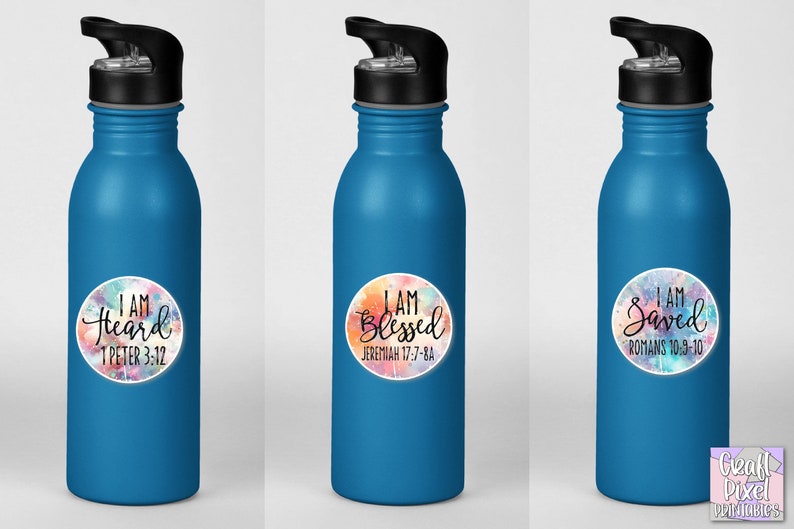 May include: Three blue water bottles with colorful, round stickers. Each sticker has a different inspirational quote and bible verse. The quotes are "I am Heard", "I am Blessed", and "I am Saved".