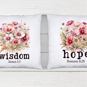 May include: Two white pillow covers with floral designs and inspirational words. The left pillow features a pink and white floral design with the word "wisdom" and the scripture "James 1:5". The right pillow features a pink and white floral design with the word "hope" and the scripture "Romans 8:28".