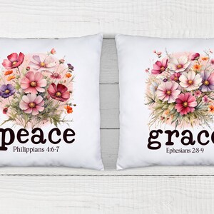 May include: Two white pillow covers with floral designs and inspirational words. The left pillow features a pink and white floral design with the word "peace" and the scripture Philippians 4:6-7. The right pillow features a similar floral design with the word "grace" and the scripture Ephesians 2:8-9.