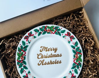 Plato de blasfemias plateadas Feliz Navidad, imbéciles
