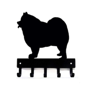 May include: Black metal key holder shaped like a silhouette of a Chow Chow dog with five hooks.