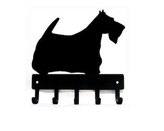 May include: Black metal key holder shaped like a Scottish Terrier silhouette with five hooks.
