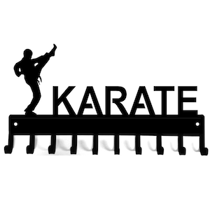 Black powder coated metal, ten hook medal display rack with the silhouette of a martial artist doing a high kick and the word karate across the top.