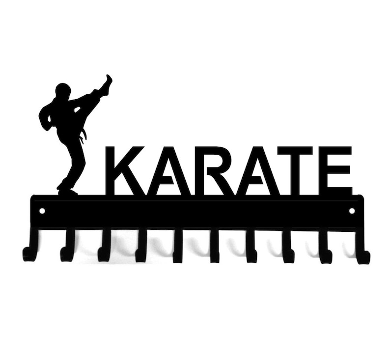 Black powder coated metal, ten hook medal display rack with the silhouette of a martial artist doing a high kick and the word karate across the top.