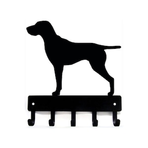 May include: Black metal key holder with a silhouette of a German Shorthaired Pointer dog. The holder has five hooks.
