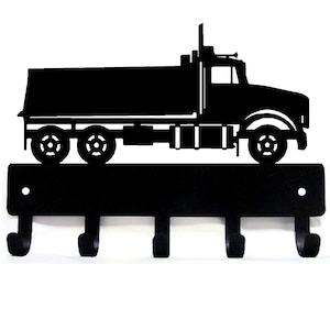 May include: Black metal key holder shaped like a dump truck with five hooks.
