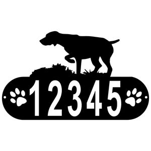 May include: Black metal house number sign with a silhouette of a dog pointing, two paw prints, and the numbers 12345.