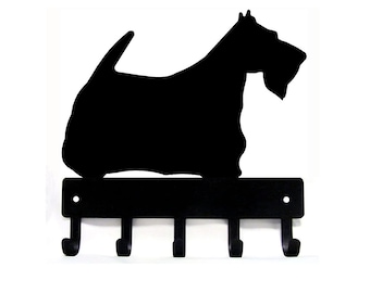 May include: Black metal key holder shaped like a Scottish Terrier silhouette with five hooks.
