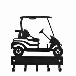 May include: Black metal golf cart key holder with five hooks. The silhouette design features a golf cart with a roof, steering wheel, and seat. The key holder is mounted on a white background.