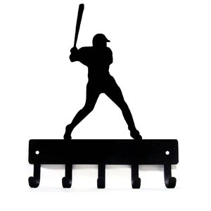 May include: Black metal key holder with a silhouette of a baseball player swinging a bat. The key holder has five hooks.