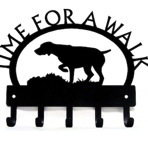 May include: Black metal key holder with a silhouette of a dog and the text "Time for a walk". The key holder has five hooks.