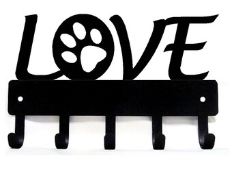 May include: Black metal key holder with five hooks. The word "LOVE" is cut out of the metal with a paw print in the "O".