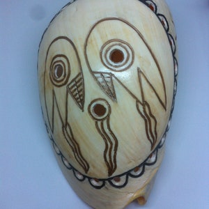 Engraved Melo Shell:  Replica of a Shaman&#39;s Head with the Weeping Eyes Motif of the Mississippi Culture  (around 1200 - 1400 AD)